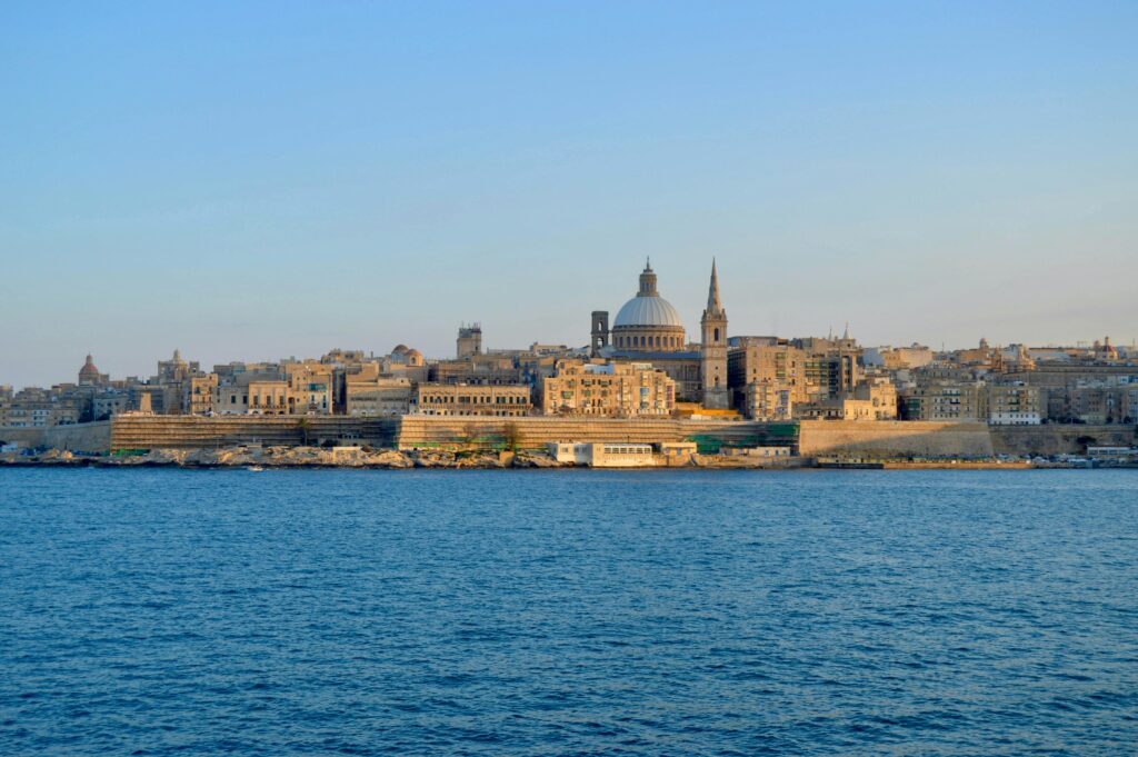 Moving to Malta Capture of the majestic skyline of Valletta, Malta, featuring iconic architecture under a clear blue sky.